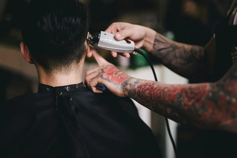 A men's clipper cut finished at the neckline